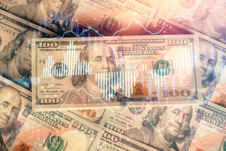 Multi exposure of forex chart drawing over us dollars bill background. Concept of financial success markets.の写真素材