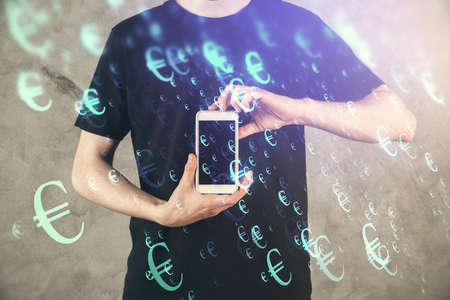 Double exposure of mans hands holding and using a digital device and forex graph drawing. Financial...