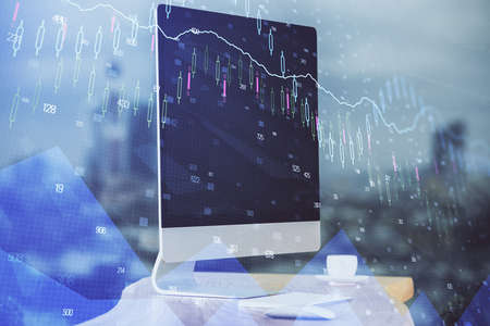 Double exposure of forex chart and work space with computer. Concept of international online...