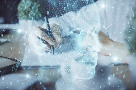 Multi exposure of writing hand on background with brain hologram. Concept of self learning.
