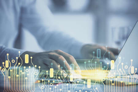 Businessman with computer background with technology theme hologram. Concept of hightech. Multi...