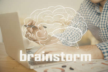 Start up drawings with businessman working on computer on background. Teamwork concept. Double exposure.の写真素材