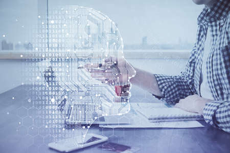 Man typing on keyboard background with brain hologram. Concept of big Data. Double exposure.