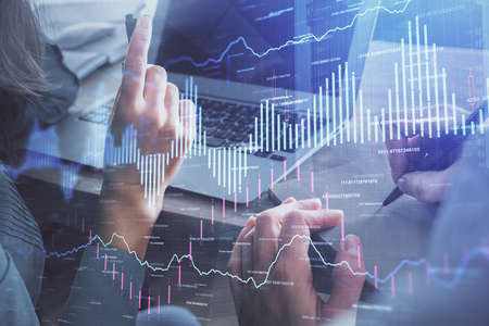 Double exposure of man and woman working together and forex chart hologram. Business concept....