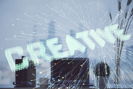 Desktop computer background in office and start up theme hologram drawing. Double exposure. Startup concept.の写真素材