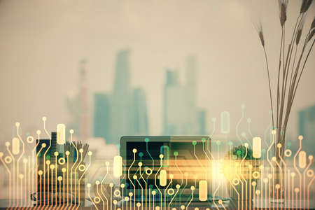 Double exposure of table with computer on background and data theme hologram. Data technology concept.の写真素材