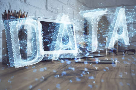 Double exposure of desktop with personal computer on background and tech theme drawing. Concept of data analysis.の写真素材