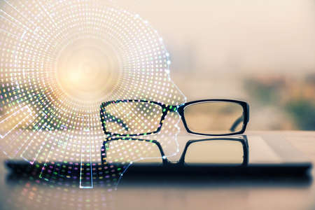 Brain drawings with glasses on the table background. Double exposure.の写真素材