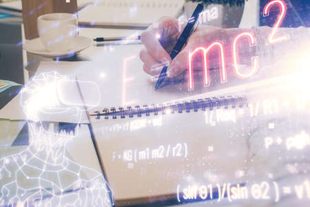 Science formula hologram over womans hands taking notes background. Concept of study. Multi exposure
