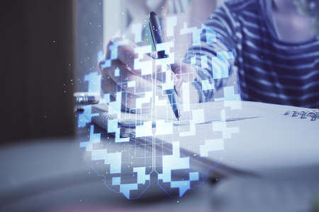 Double exposure of hands making notes with digital coding icons. Computer learning concept.