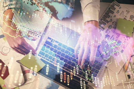 Double exposure of man and woman working together and forex graph hologram drawing. Financial...