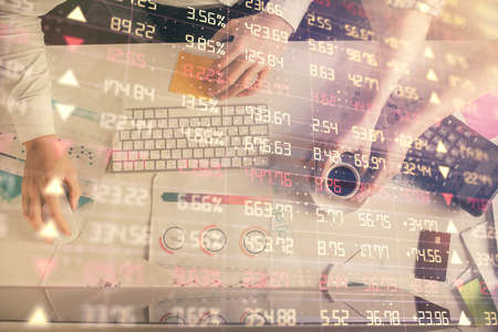 Double exposure of man and woman working together and financial chart hologram drawing. market...