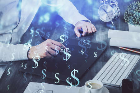 Double exposure of mans hands holding and using a phone and financial graph drawing. Analysis...