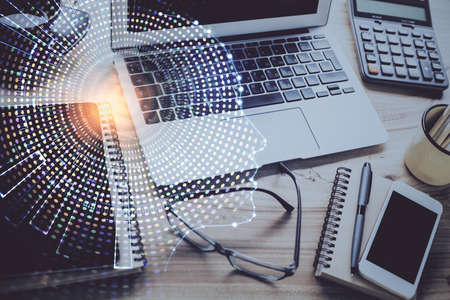 Double exposure of desktop with computer and brain drawing hologram. Artificial intelligence...