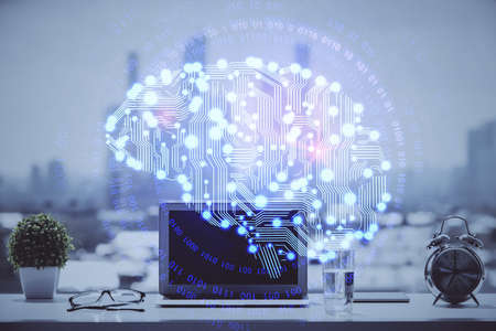 Double exposure of desktop with computer and brain drawing hologram. Artificial intelligence...
