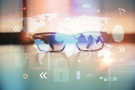 Map hologram with glasses on the table background. Concept of globalization. Double exposure.