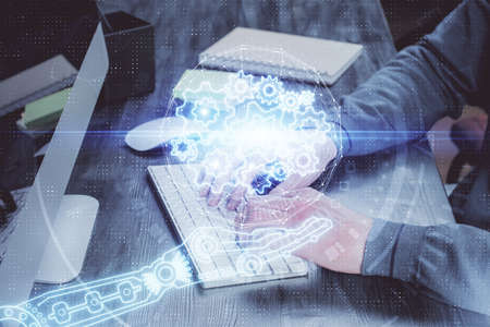 Double exposure of technology hologram with man working on computer background. Concept of big data.