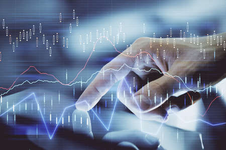 Multi exposure of mans hands holding and using a digital phone and forex graph drawing. Financial...