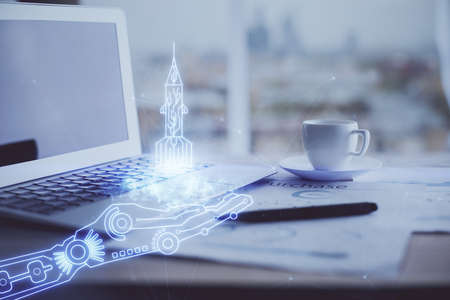 Desktop computer background in office and start up theme hologram drawing. Double exposure. Startup...