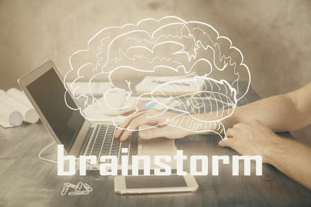 Start up drawings with businessman working on computer on background. Teamwork concept. Double exposure.の写真素材