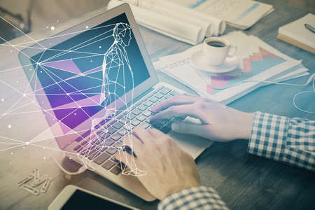 Start up drawings with businessman working on computer on background. Teamwork concept. Double exposure.の写真素材