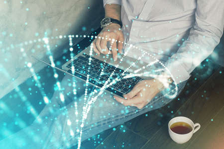 DNA hologram with businessman working on computer on background. Concept of bioengineering. Double...