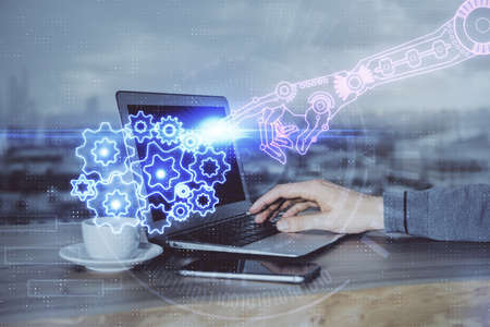 Multi exposure of technology hologram with man working on computer background. Concept of big data.