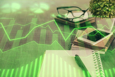 Double exposure of forex chart drawing and cell phone background. Concept of financial trading