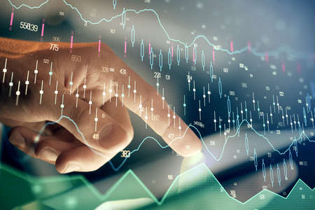 Multi exposure of mans hands holding and using a phone and financial chart drawing. Market analysis concept.の写真素材