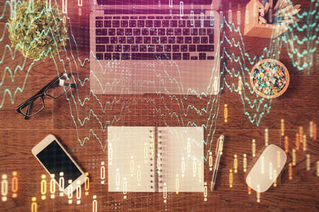Stock market graph and top view computer on the table background. Multi exposure. Concept of...