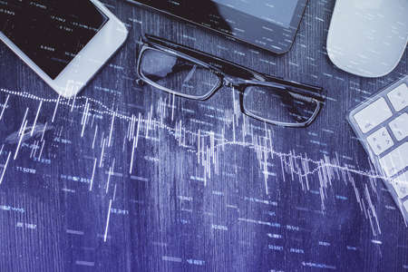 Multi exposure of forex graph hologram over desktop with phone. Top view. Mobile trade platform concept.の写真素材