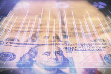 Double exposure of forex graph drawing over us dollars bill background. Concept of financial markets.の写真素材