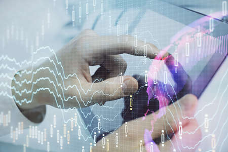 Multi exposure of mans hands holding and using a phone and financial chart drawing. Market analysis...