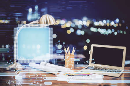 Double exposure of table with computer on background and data theme hologram. Data technology...