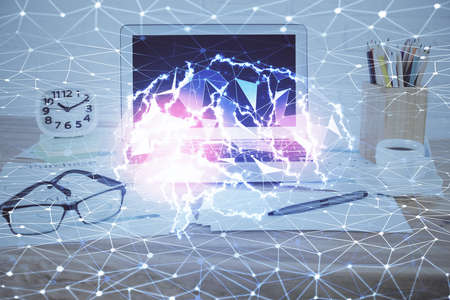 Double exposure of desktop with computer and brain drawing hologram. Artificial intelligence...