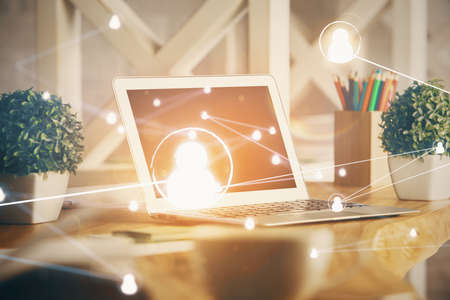 Computer on desktop with social network hologram. Double exposure. Concept of international people connections.の写真素材