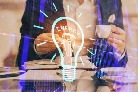 Innovative your business. Idea concept icon on writing mans hand background. Multi exposure.の写真素材