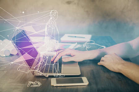 Start up drawings with businessman working on computer on background. Teamwork concept. Double exposure.の写真素材