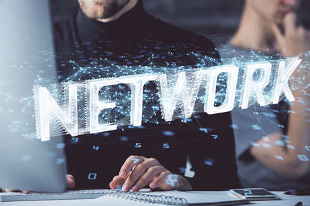 Multi exposure of data internet theme hologram with man working on computer on background. Concept...