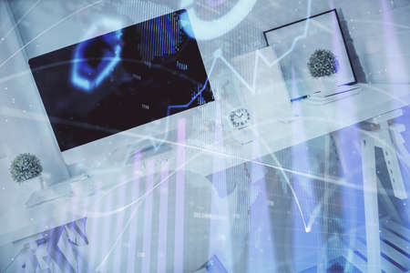 Double exposure of financial graph drawing and office interior background. Concept of stock market.の写真素材