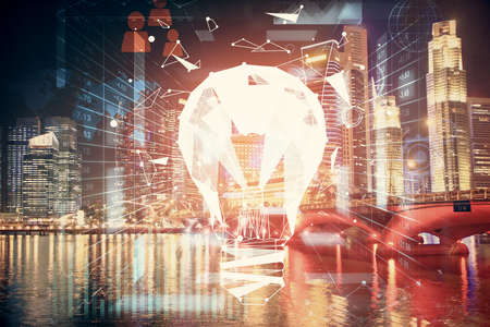 Multi exposure of bulb hologram drawing and cityscape background. Concept of idea.の写真素材