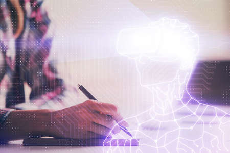 Cryptocurrency hologram over womans hands writing background. Concept of blockchain. Multi exposure