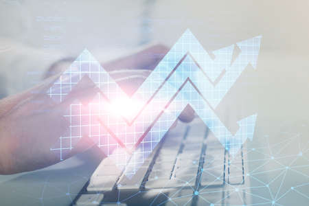 Growing arrows with businessman working on computer on background. Success concept. Double exposure.