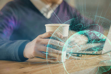 Media network theme hologram with man working on computer on background. Concept of internet...