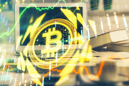 Multi exposure of blockchain and crypto economy theme hologram and table with computer background. Concept of bitcoin cryptocurrency.の写真素材