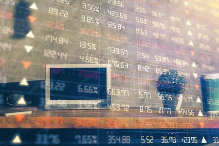 Multi exposure of chart and financial info and work space with computer background. Concept of...
