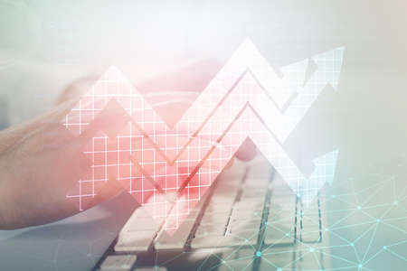 Growing arrows with businessman working on computer on background. Success concept. Double exposure.