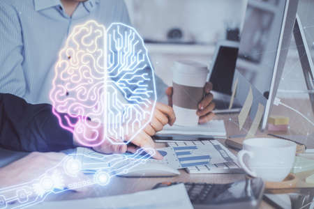 Man with computer background with brain theme hologram. Concept of brainstorm. Double exposure.