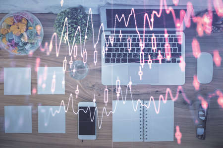 Stock market graph and top view computer on the table background. Multi exposure. Concept of...