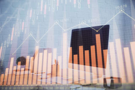 Double exposure of stock market graph drawing and office interior background. Concept of financial...